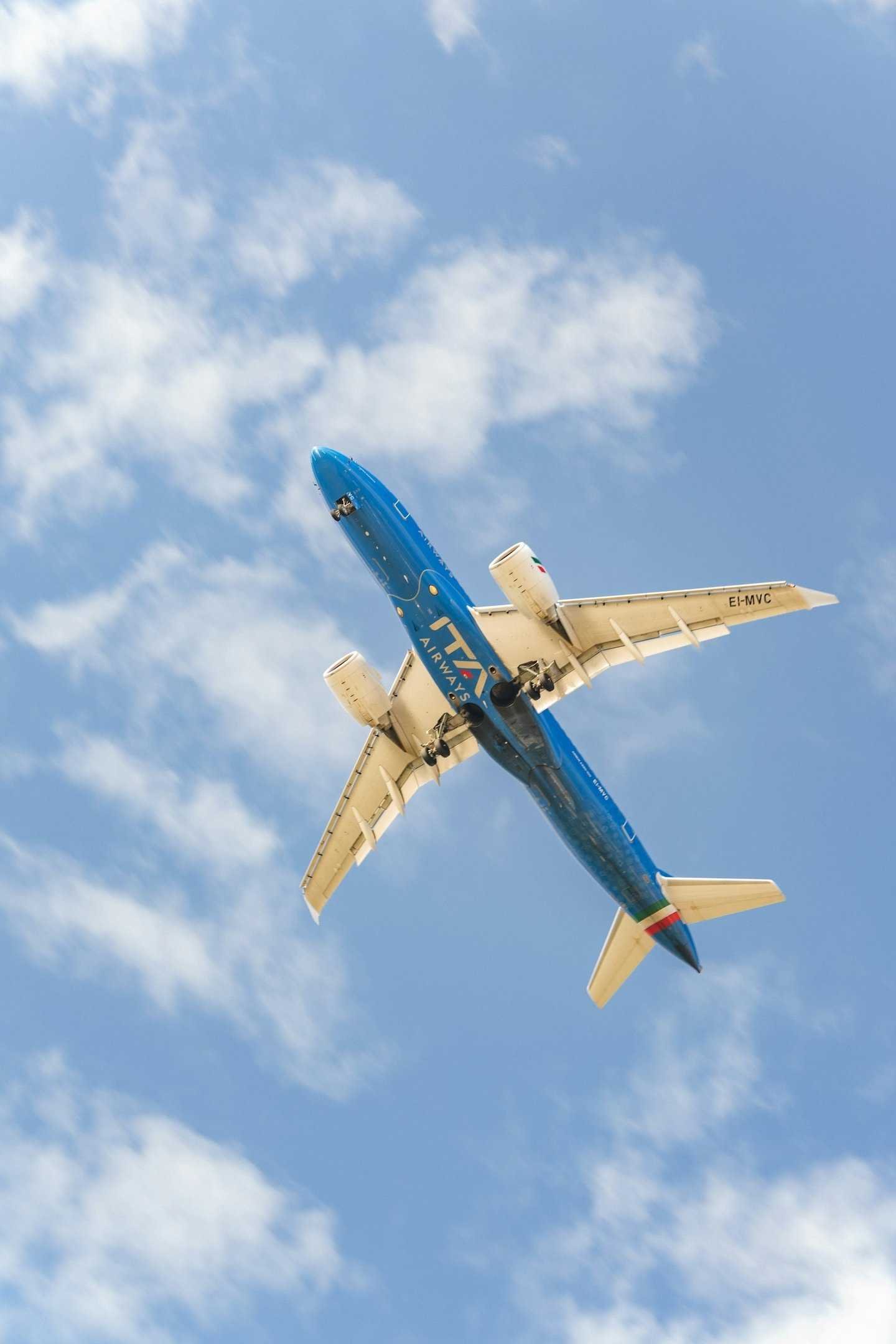 ITA Airways plane flying overhead